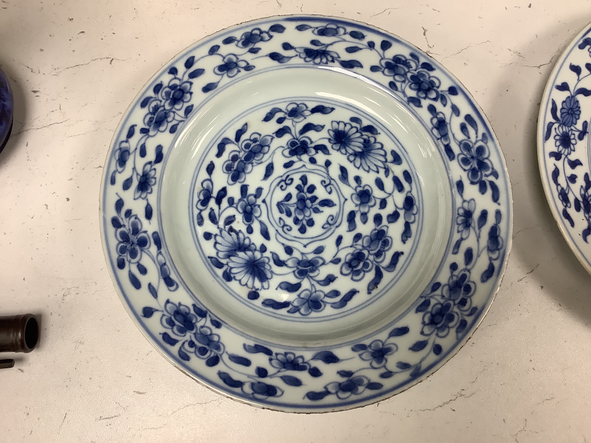 A pair of 18th century Chinese blue and white plates, together with two Chinese Imari dishes, all Kangxi period, largest 23cm